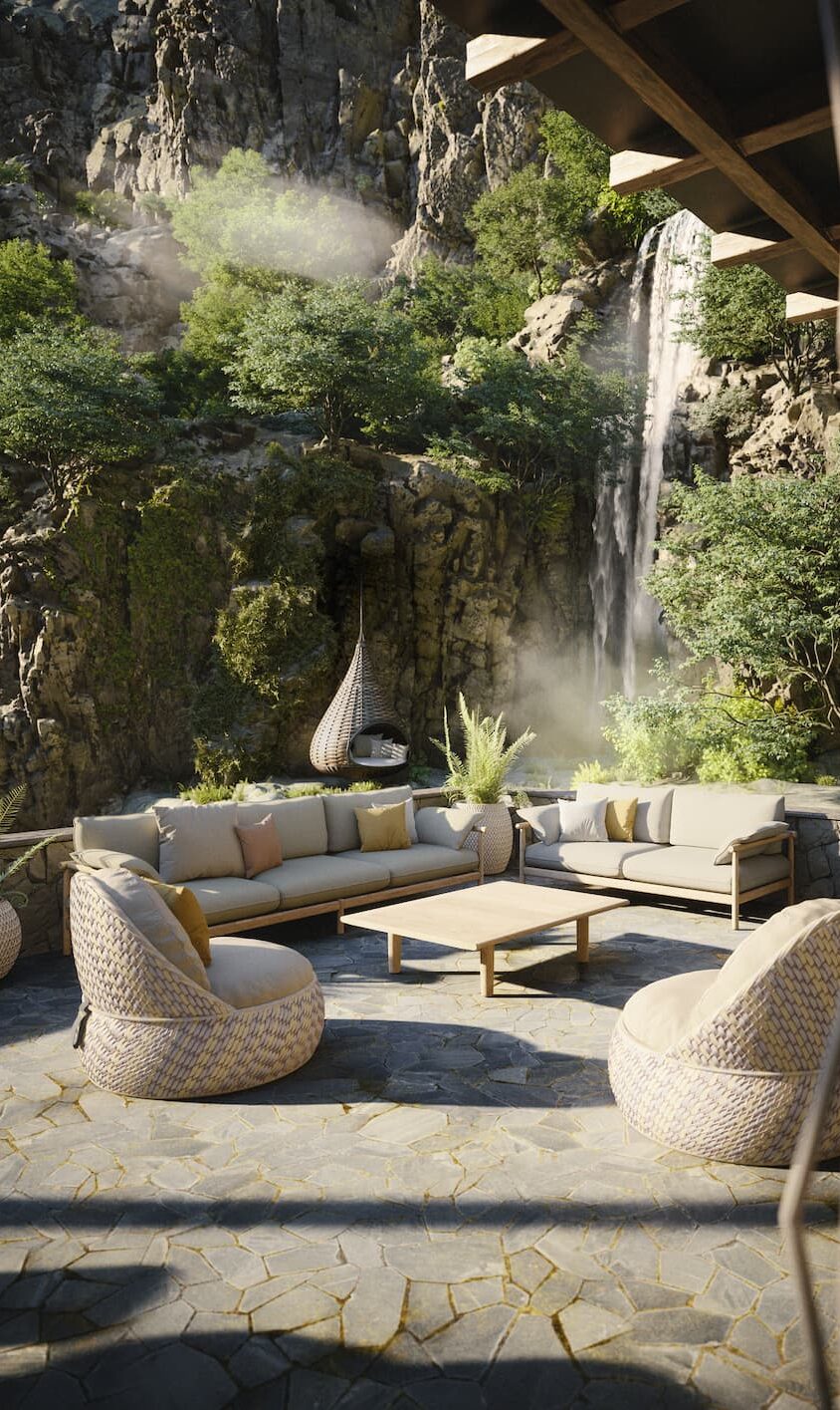 Eine gemütliche Außenterrasse mit modernen Gartenmöbeln und Kissen bietet einen Blick auf üppiges Grün und einen Wasserfall, der eine Felswand hinunterstürzt. Das Sonnenlicht fällt durch die Bäume und schafft eine ruhige, einladende Atmosphäre, inspiriert durch Handwerk aus Deutschland und Luxemburg.